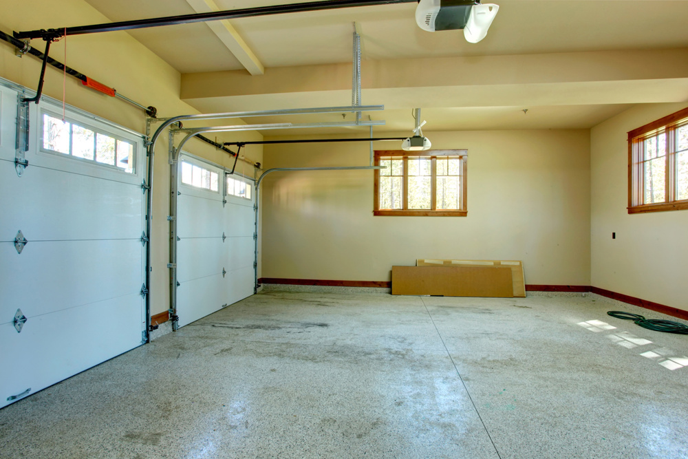 Empty garage with roller door. View of horizontal tracks