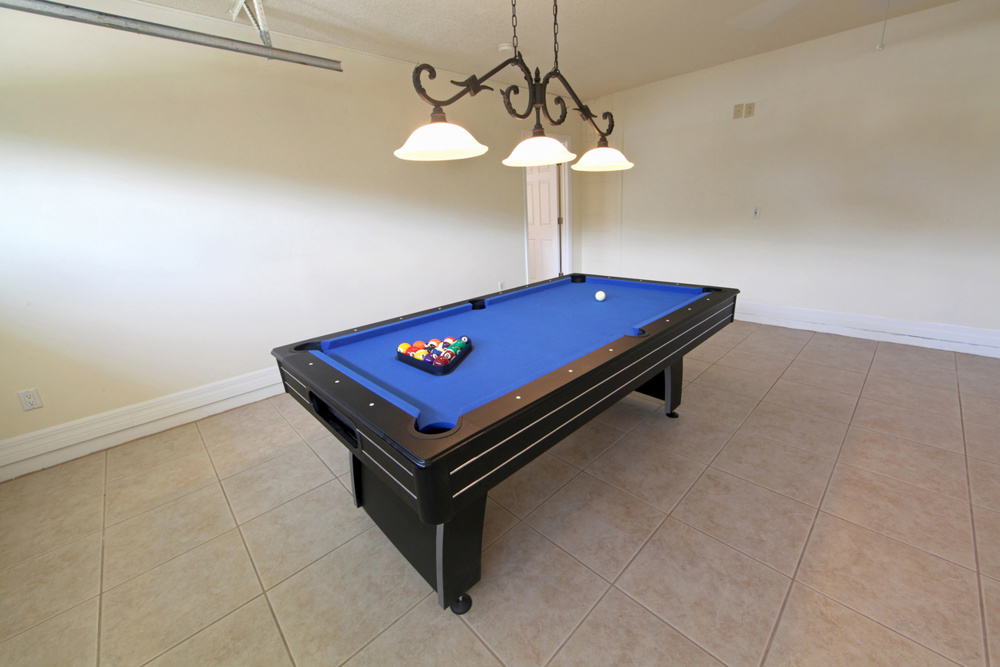 A pool table in a garage