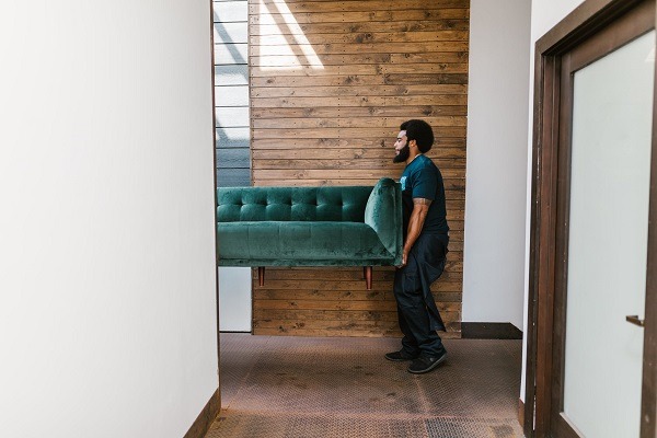 man and van service crew moving a sofa