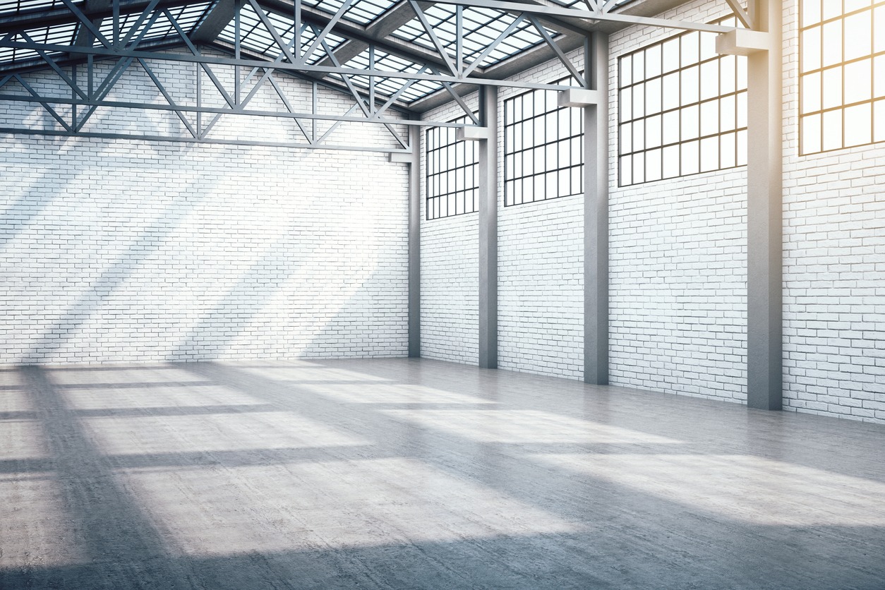 Modern warehouse interior with window and daylight.