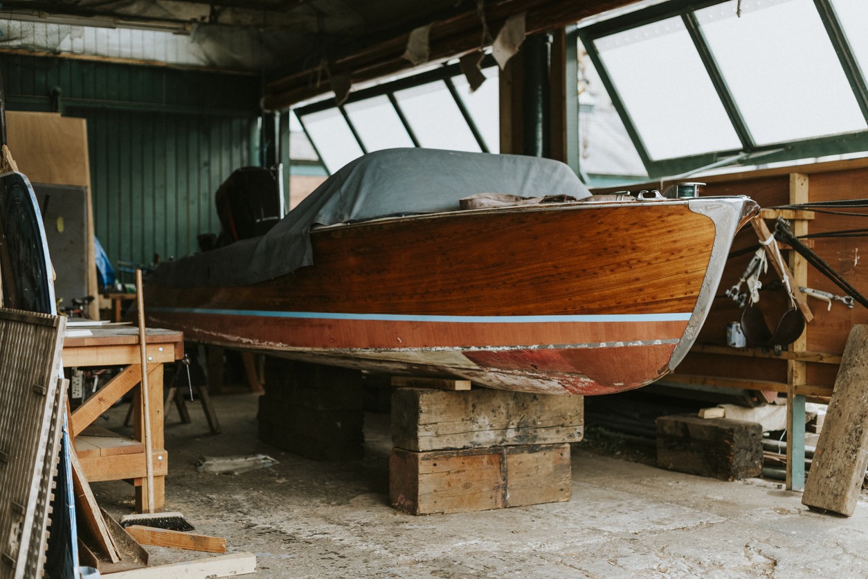 Old wooden boat in a garage