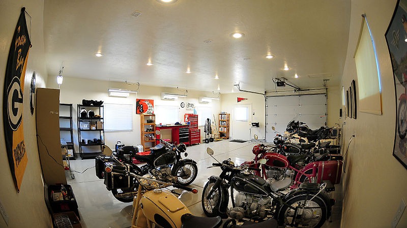 a garage turned into a Man Cave containing lots of motorcycles